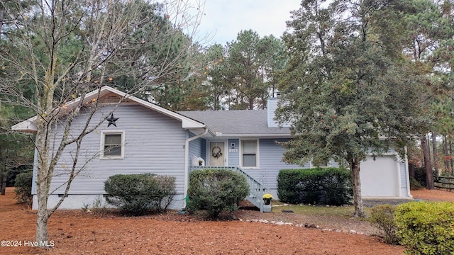 view of front of property featuring a garage