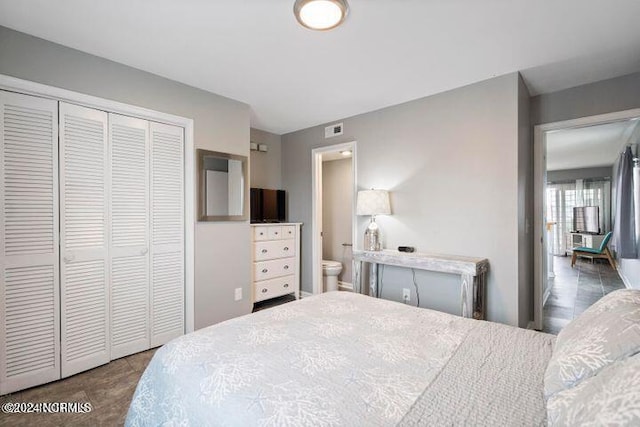 bedroom featuring ensuite bath and a closet