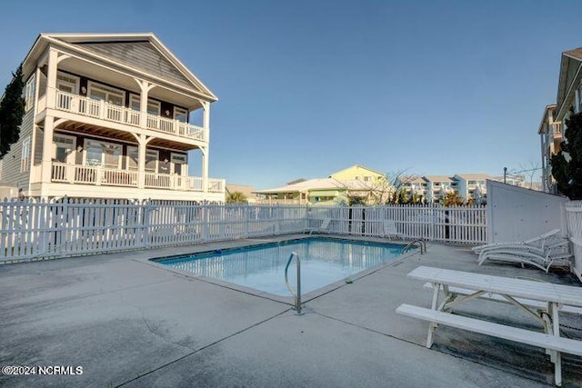 view of pool with a patio area