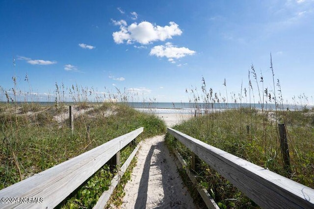 property view of water featuring a view of the beach