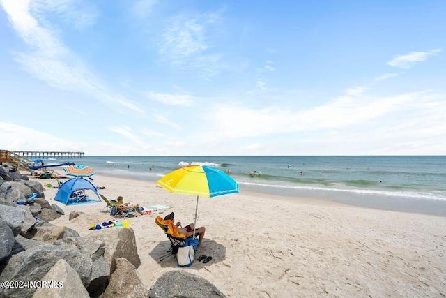 view of water feature with a beach view