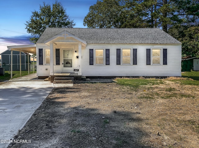 view of front of home featuring a carport