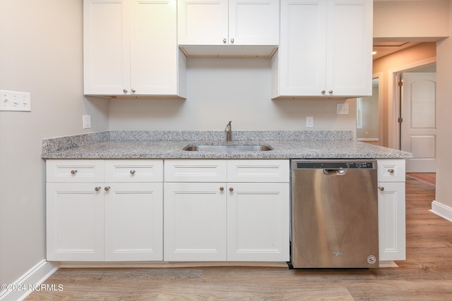 kitchen with dishwasher, light wood-type flooring, sink, and white cabinetry