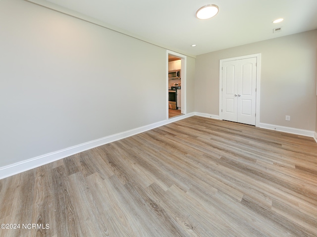 interior space with light hardwood / wood-style flooring and a closet