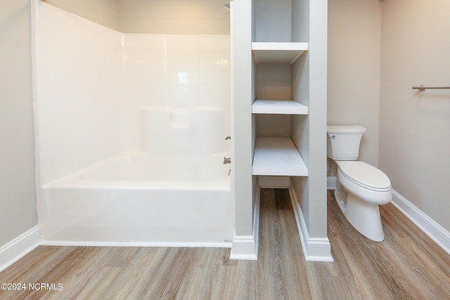 bathroom featuring wood-type flooring and toilet