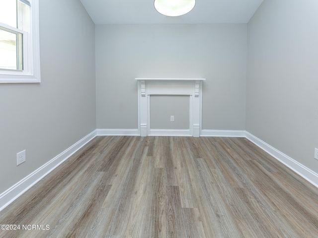 unfurnished room with light wood-type flooring