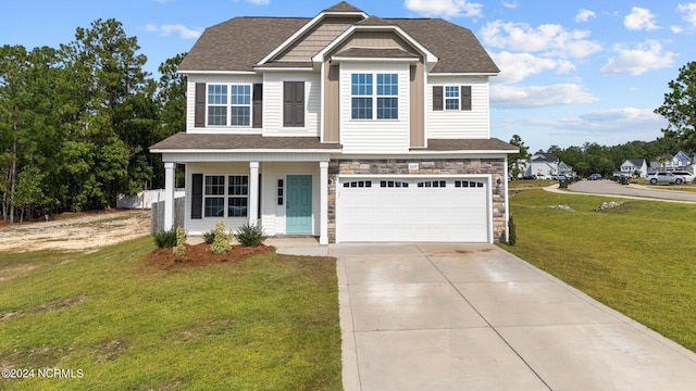 view of front of home with a garage, a front lawn, and covered porch