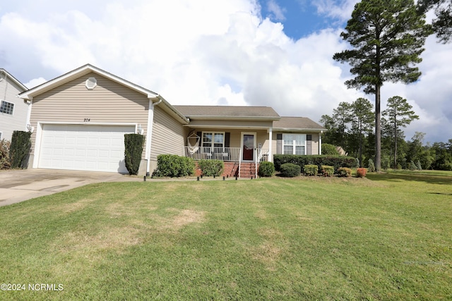 view of front facade with a garage, a front lawn, and covered porch