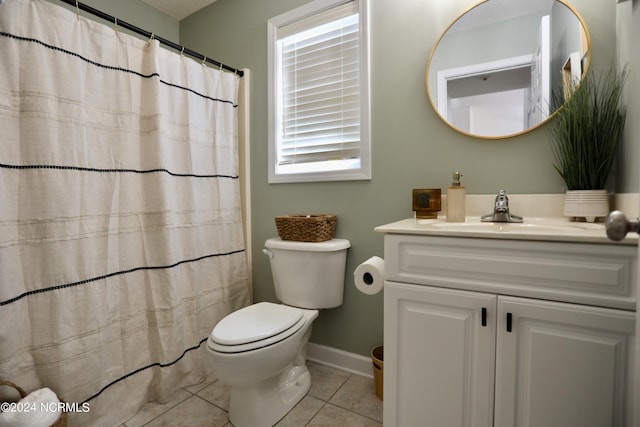 bathroom with curtained shower, vanity, toilet, and tile patterned floors