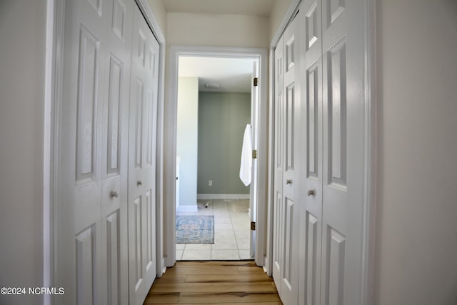 hall with light hardwood / wood-style floors