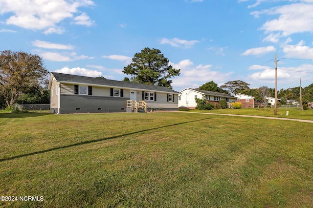 ranch-style house featuring a front lawn