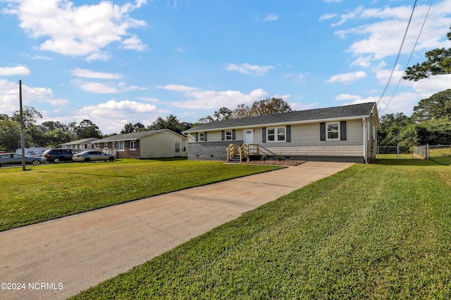 single story home featuring a front lawn