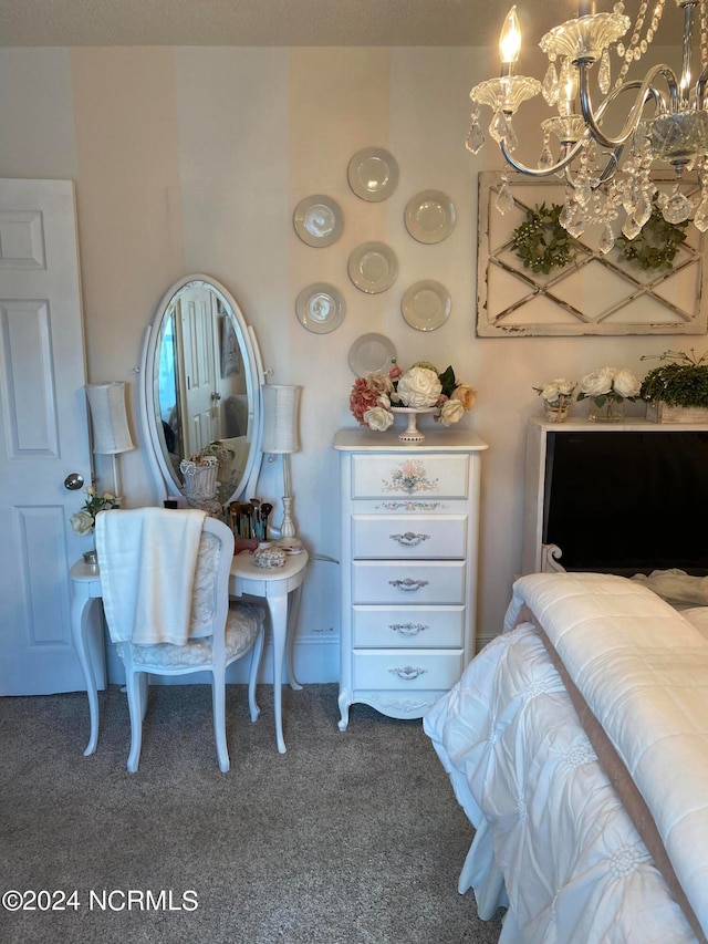 bedroom with a chandelier and carpet flooring