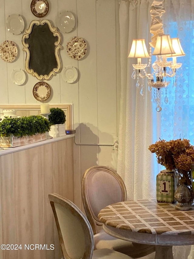 dining space featuring a notable chandelier