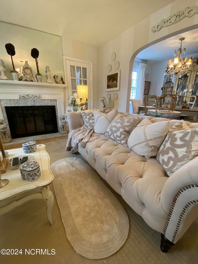 living room featuring a chandelier and light colored carpet