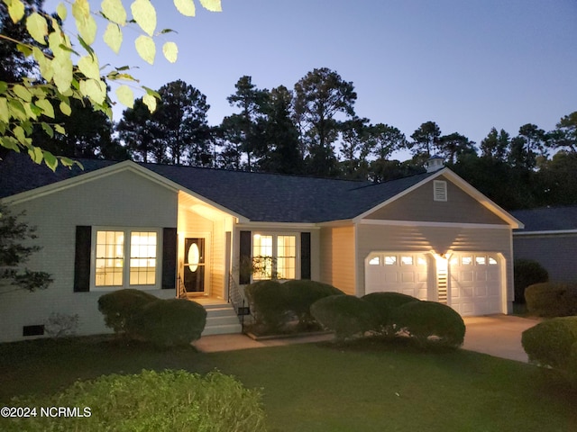 single story home featuring a garage