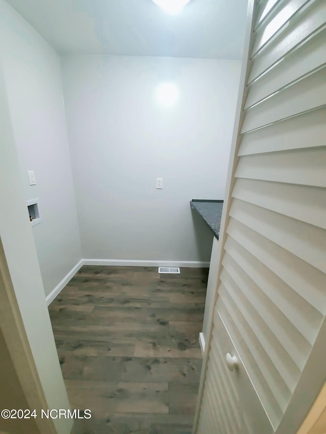 clothes washing area featuring hookup for a washing machine and dark hardwood / wood-style flooring