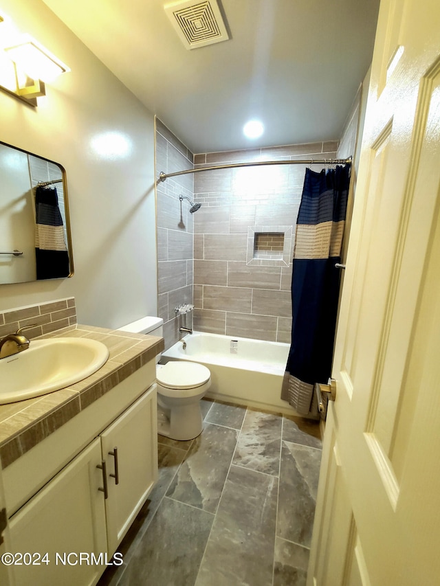 full bathroom featuring shower / bath combination with curtain, backsplash, vanity, and toilet