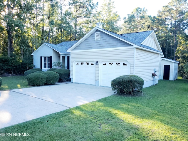 ranch-style house with a front yard and a garage