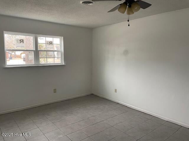 unfurnished room featuring a textured ceiling and ceiling fan