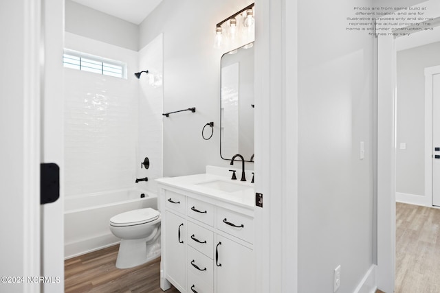 full bathroom featuring toilet, hardwood / wood-style flooring, vanity, and shower / bathtub combination