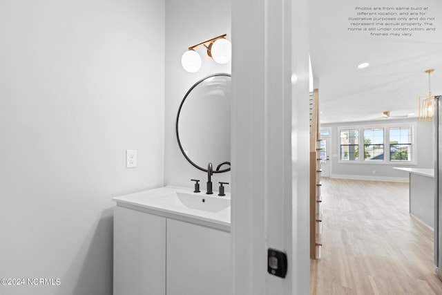 bathroom featuring vanity and hardwood / wood-style floors