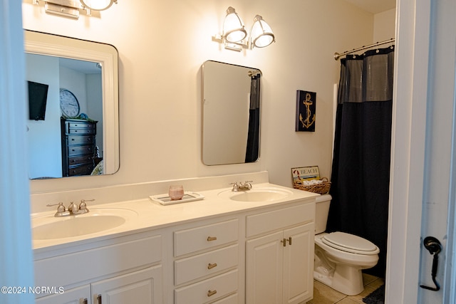 bathroom featuring walk in shower, vanity, toilet, and tile patterned floors