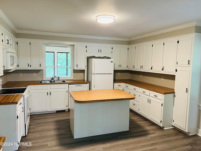 kitchen featuring white cabinets, white appliances, and a center island