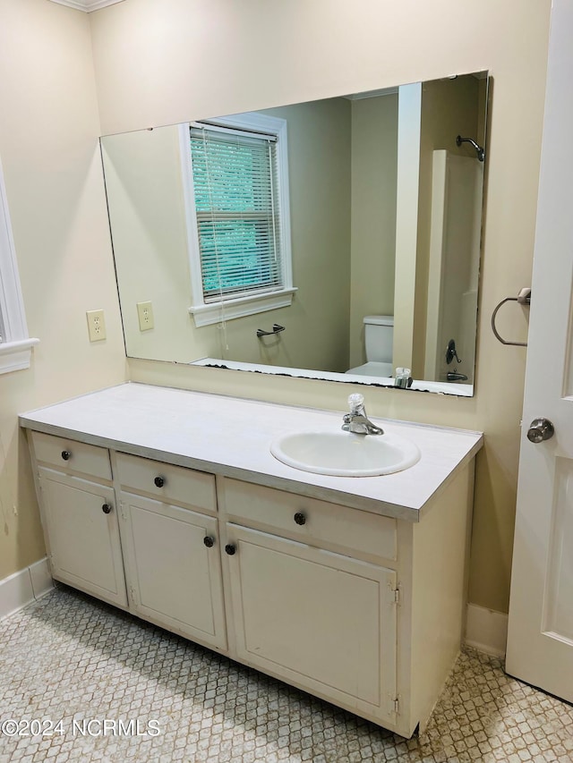 bathroom featuring vanity and toilet