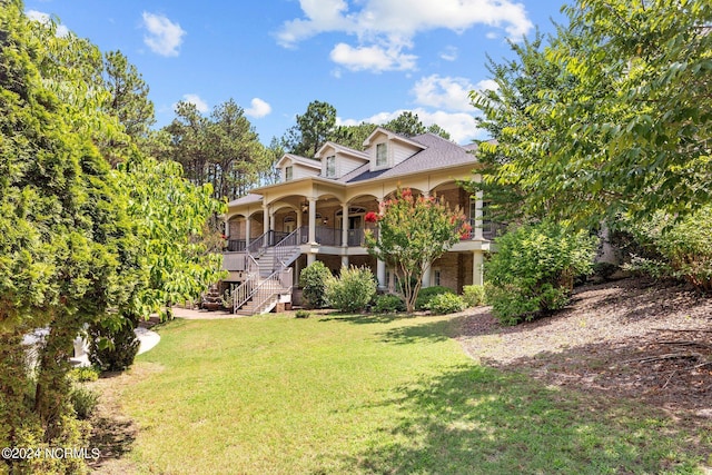 view of front of property with a porch and a front yard