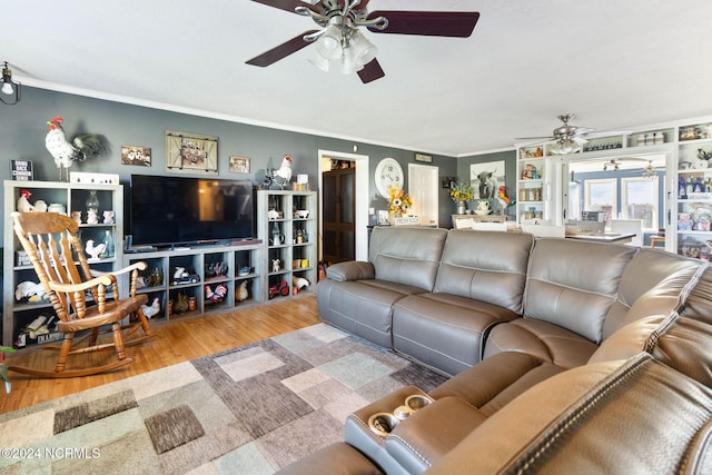 living room featuring hardwood / wood-style floors and ornamental molding