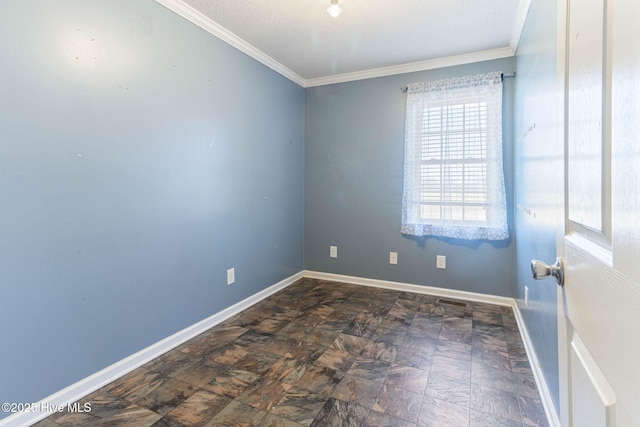 empty room with crown molding, visible vents, and baseboards