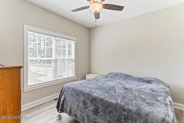 misc room with ceiling fan and light hardwood / wood-style floors