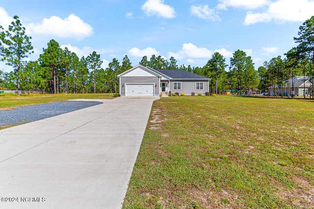 ranch-style home with a front yard and a garage