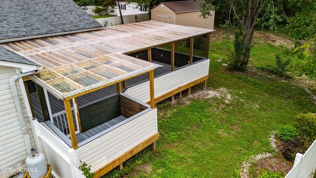 exterior space featuring fence and a sunroom