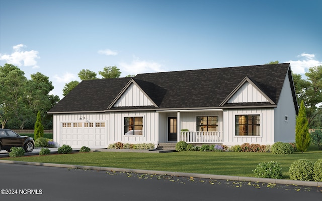 view of front of property featuring a garage, a front yard, and covered porch