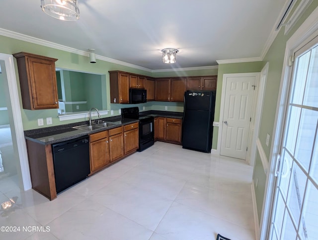 kitchen featuring light tile patterned floors, black appliances, crown molding, decorative light fixtures, and sink