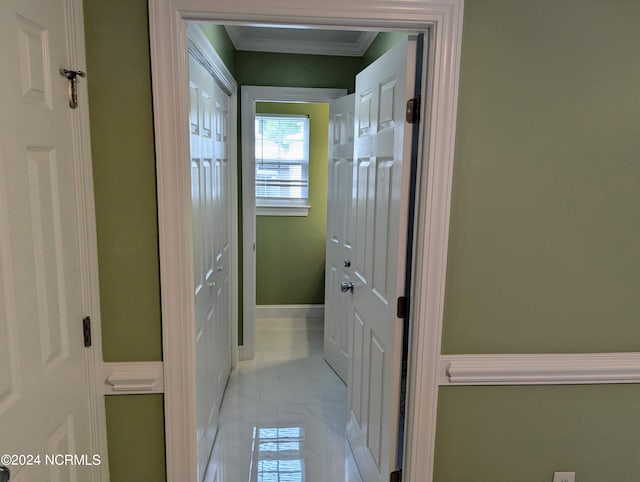 hallway featuring ornamental molding