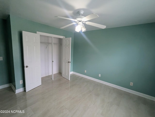 unfurnished bedroom featuring a closet and ceiling fan