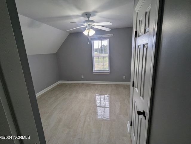 bonus room with lofted ceiling and ceiling fan