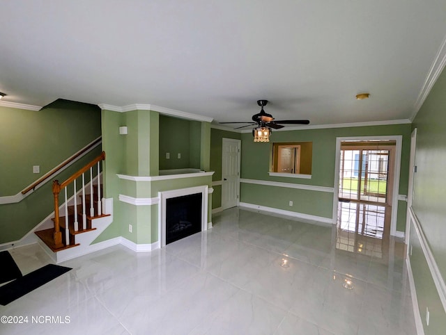 unfurnished living room featuring ornamental molding and ceiling fan