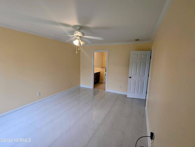 unfurnished room featuring ceiling fan and crown molding