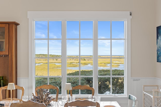 dining room featuring a water view