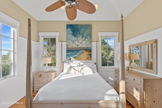 bedroom featuring lofted ceiling, ceiling fan, and hardwood / wood-style flooring