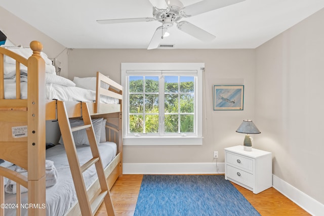 bedroom with light wood-type flooring and ceiling fan