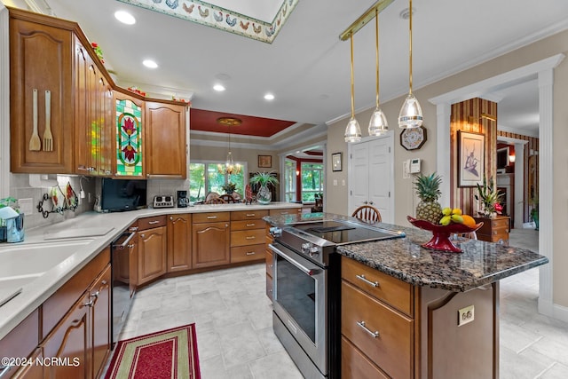 kitchen featuring brown cabinetry, stainless steel electric stove, hanging light fixtures, dishwasher, and crown molding