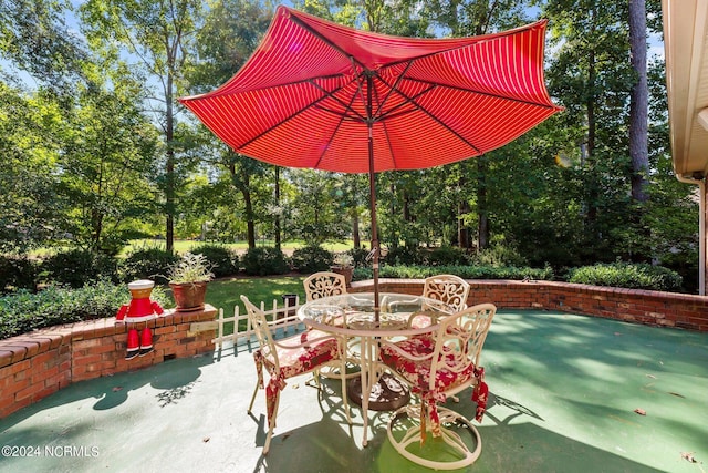 view of patio featuring outdoor dining area