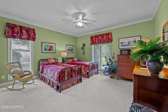 bedroom featuring ceiling fan, carpet floors, and ornamental molding