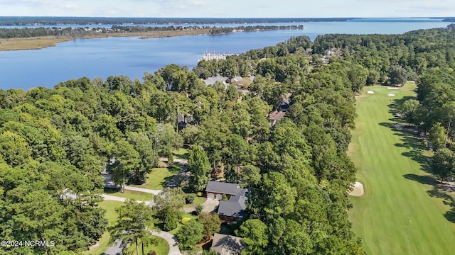 aerial view featuring view of golf course, a forest view, and a water view