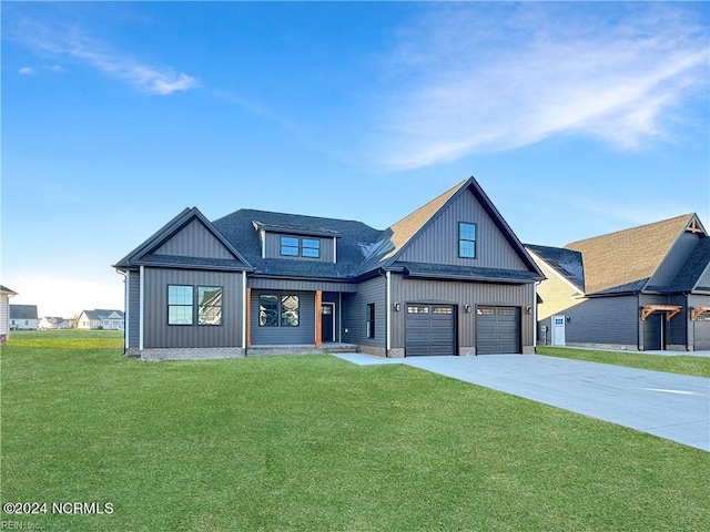 modern farmhouse with a front lawn and a garage